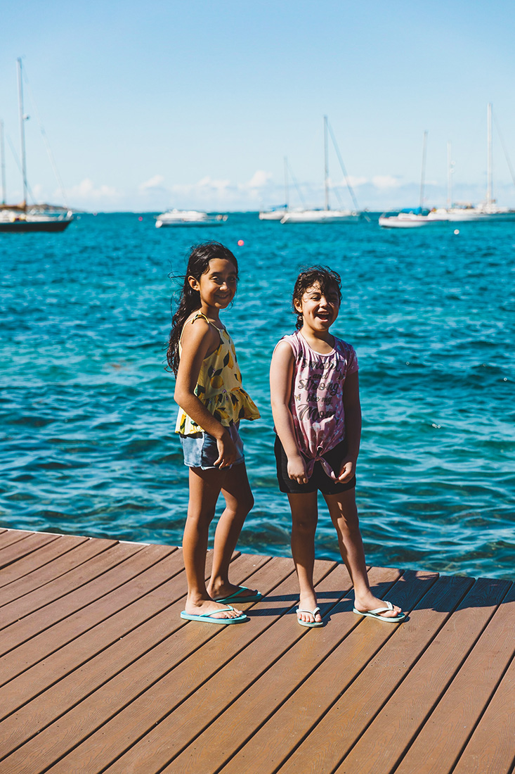 Sidda and Char Mall, standing on a pier in St. Croix