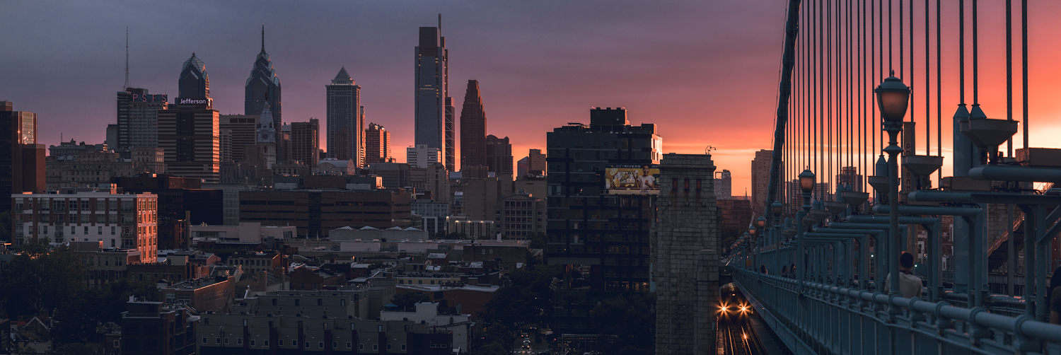 Philadelphia skyline from the Benjamin Franklin Bridge at sunset