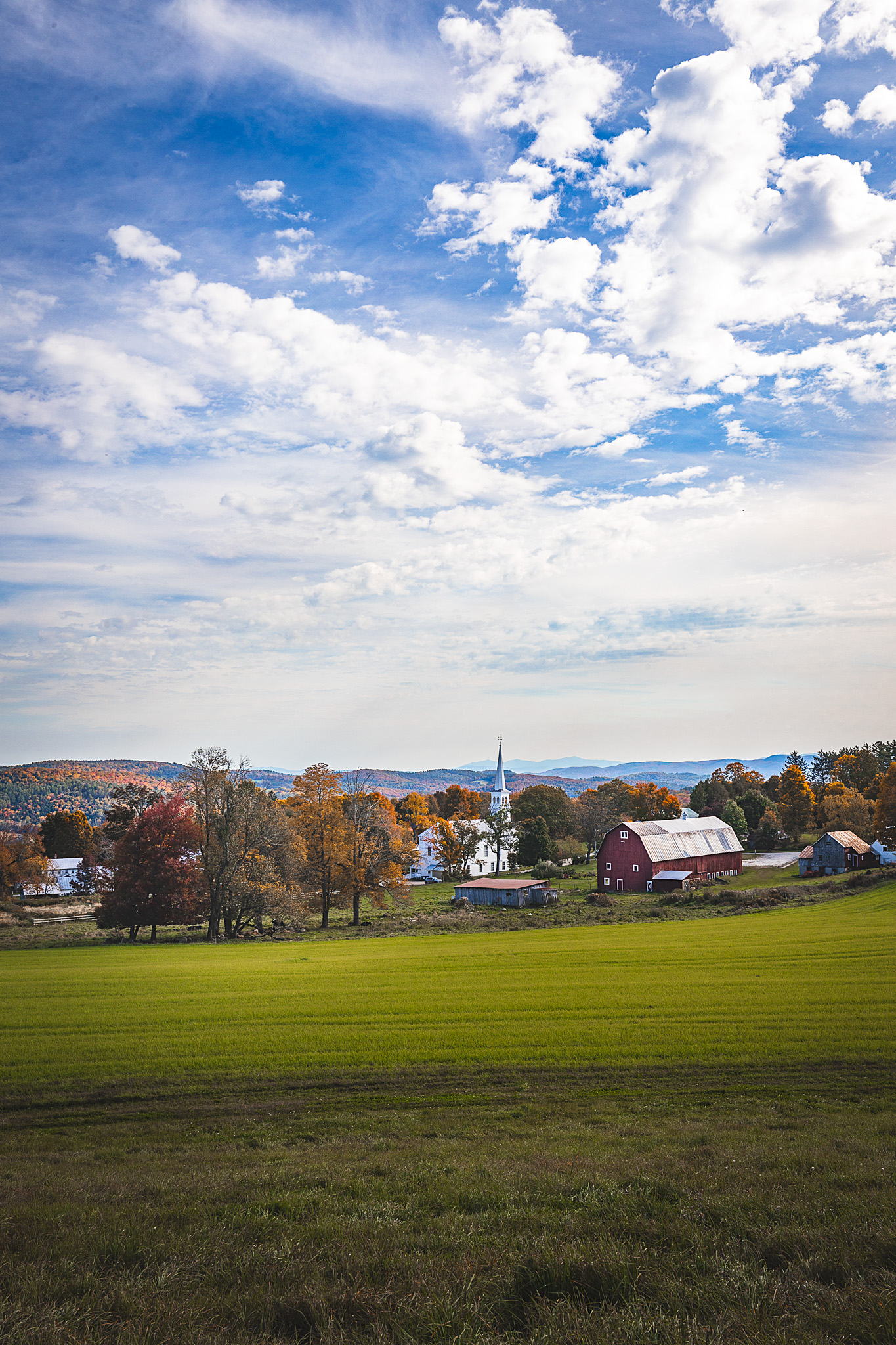 The town of Peacham on a clear day with majestic clouds in the sky