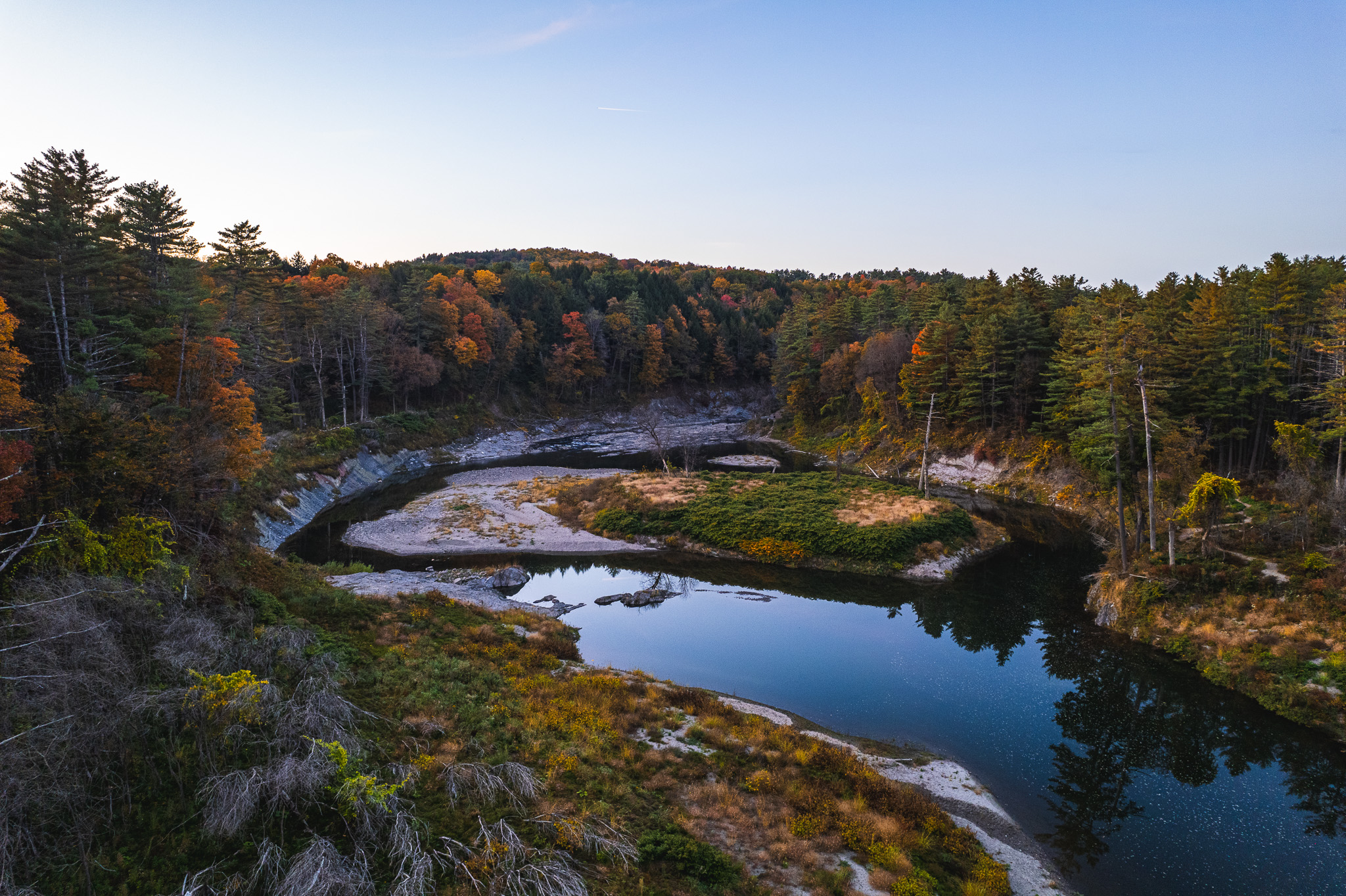 Overhead shot of foliage and water of Quechee Gorge