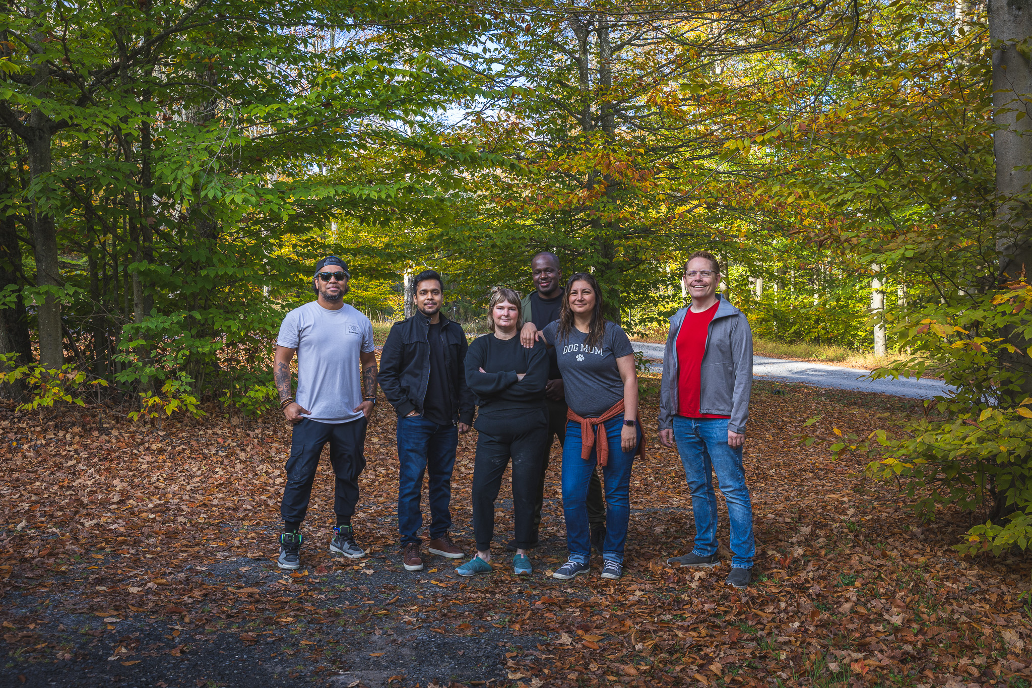 6 people standing on leaves