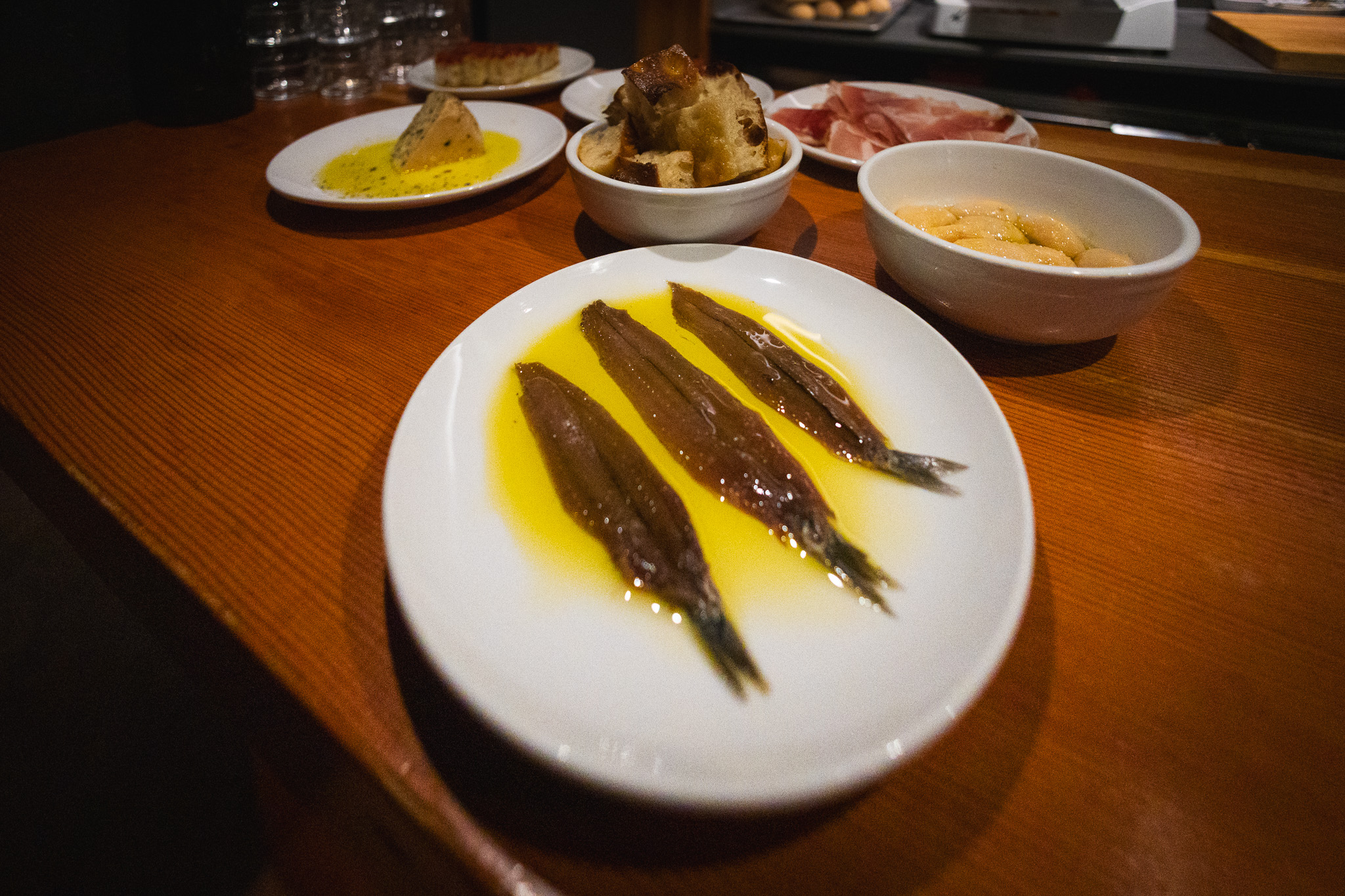 Anchovies, beans, bread, and cheese