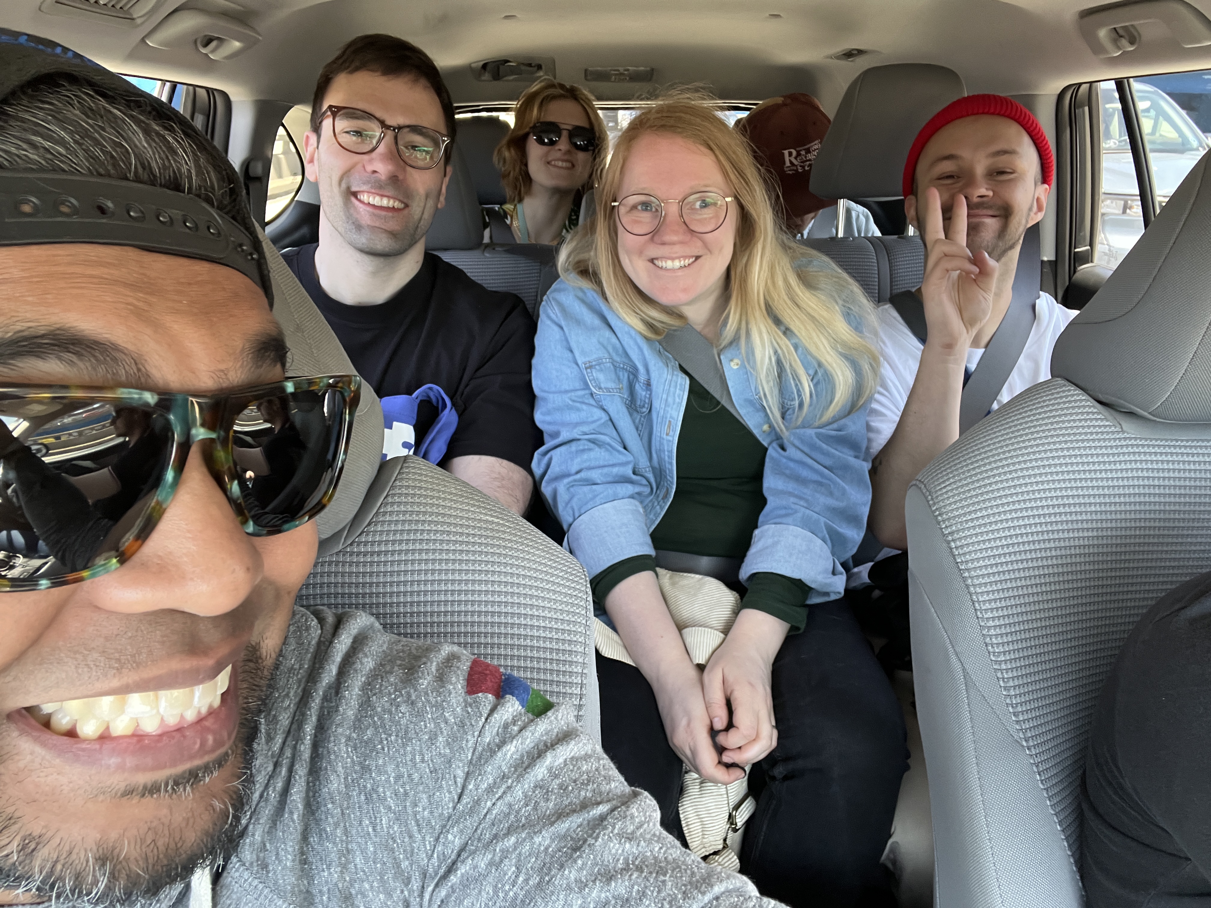 Six people in the inside of a car