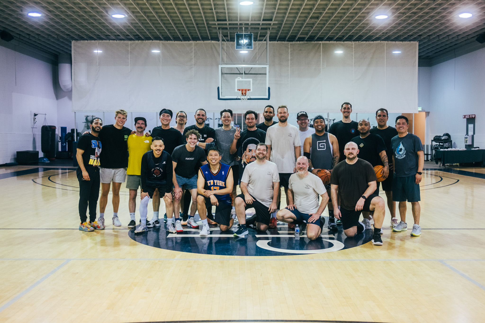 Figma Config basketball attendees posing for a photo on the basketball court