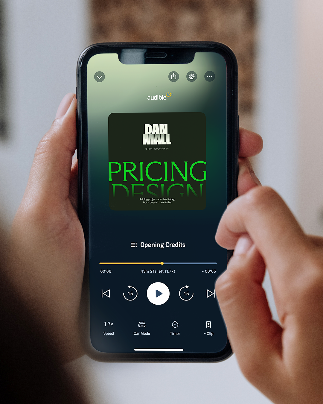 Pricing Design audiobook displayed on an iPhone