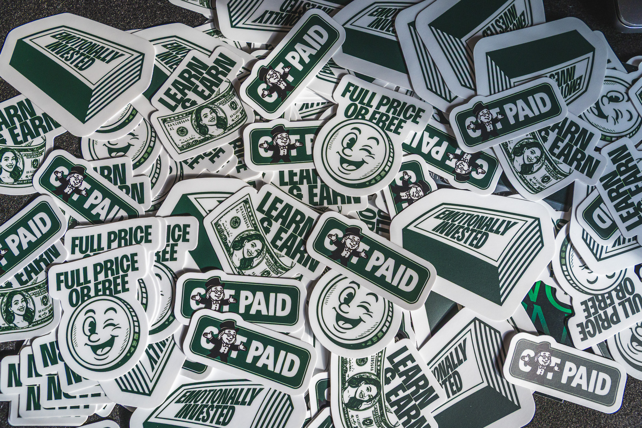 A pile of money-themed stickers