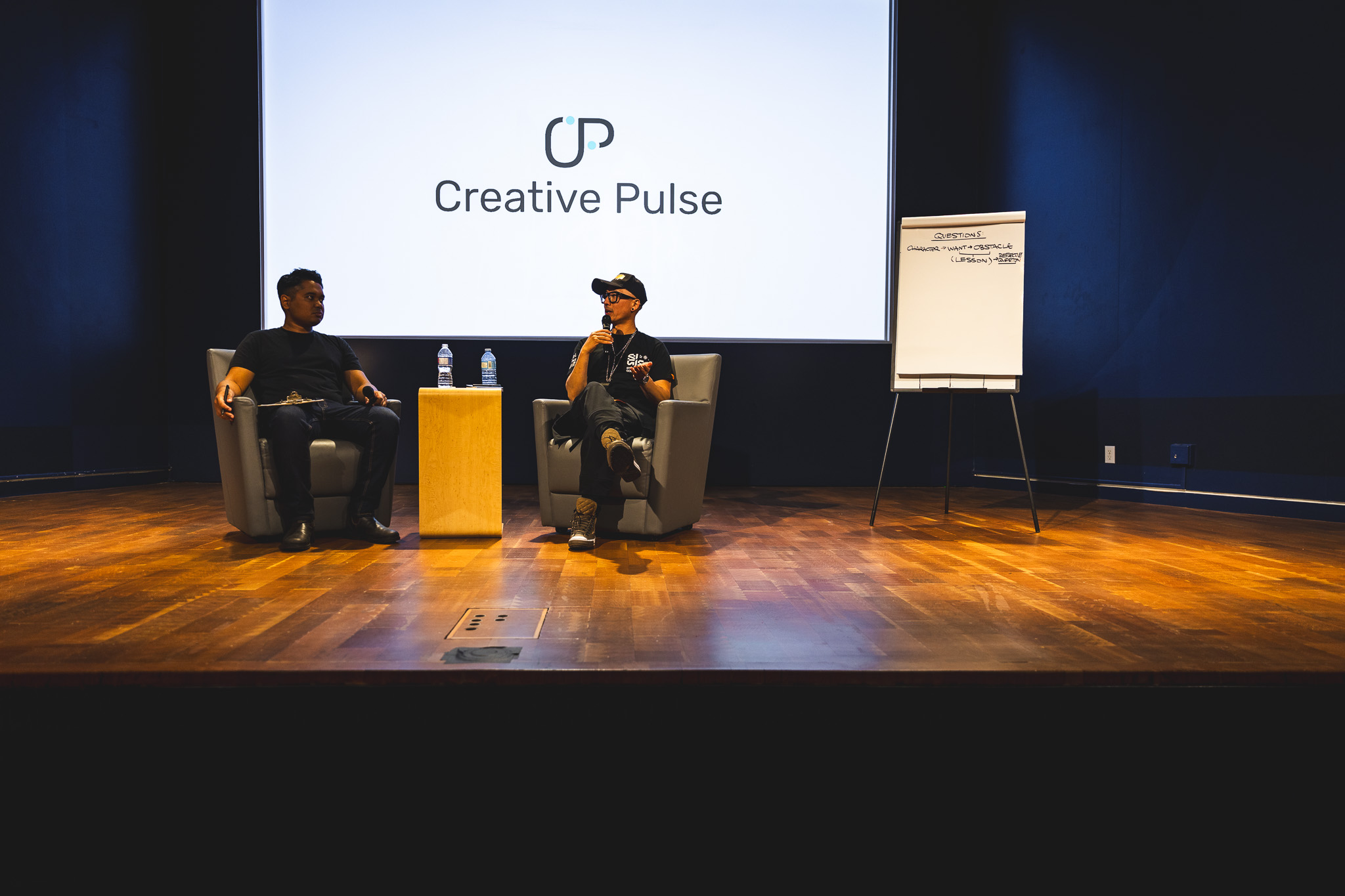 Chris Do being interviewed at a Creative Pulse fireside chat event